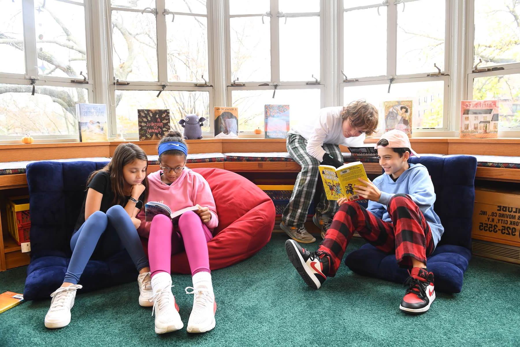 Ethical Culture Fieldston School 5th graders share books in the library