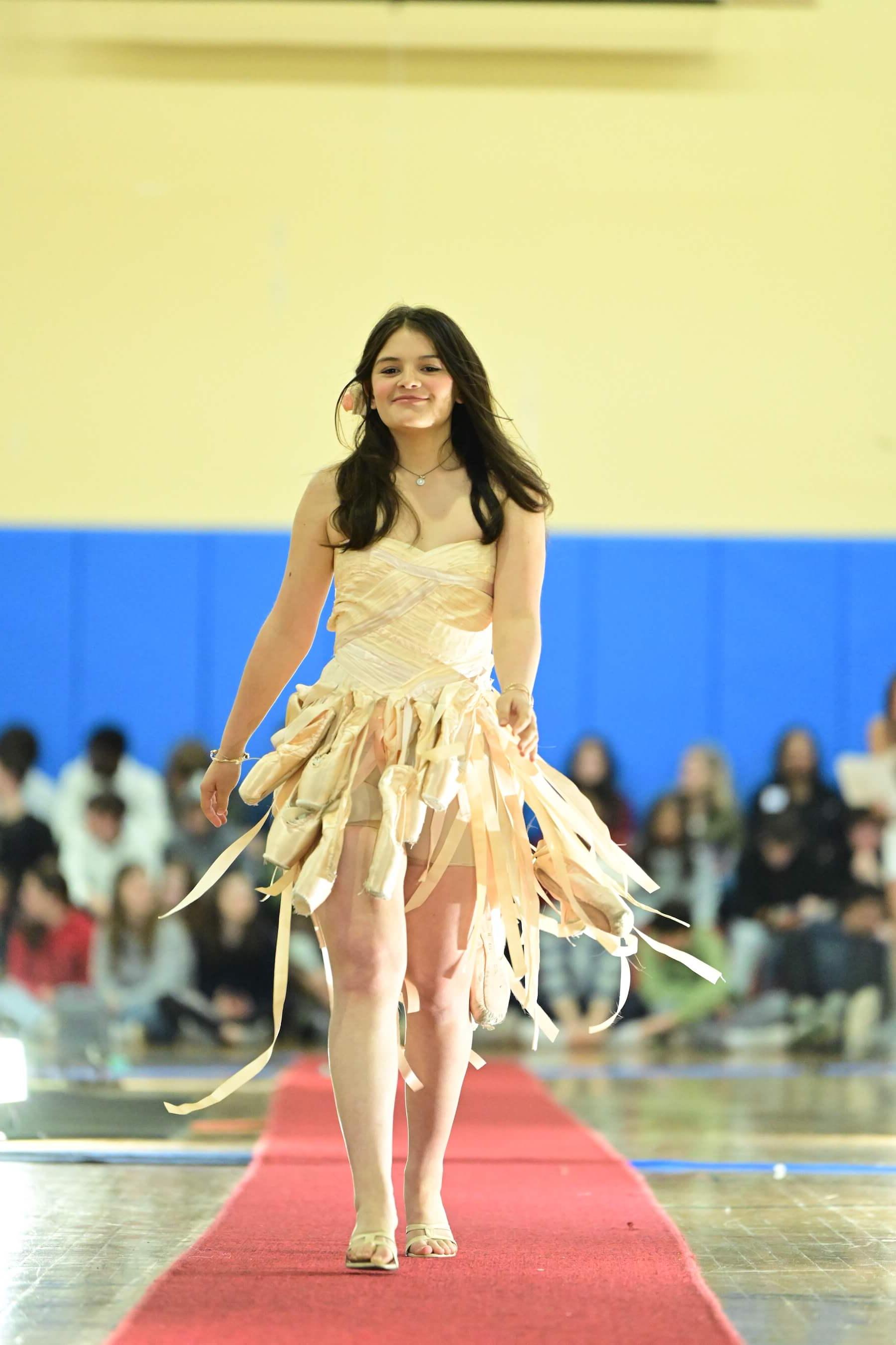 An Ethical Culture Fieldston Upper School student models at the Fashion Show.