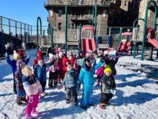 Ethical Culture Fieldston School students play in the snow in our rooftop playground