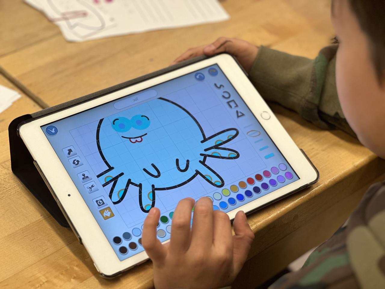 Close up of student work on iPad which displays a cartoon octopus.